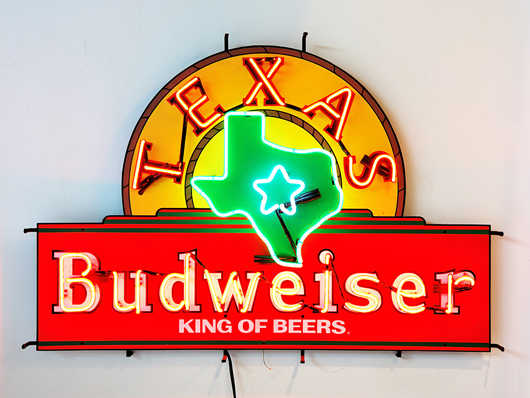 Budweiser neon advertising sign featuring the state of Texas, est. $100-$150. Image courtesy Morton Kuehnert Auctioneers.